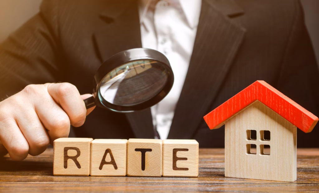 Man looking at rate on wooden blocks with magnifying glass.