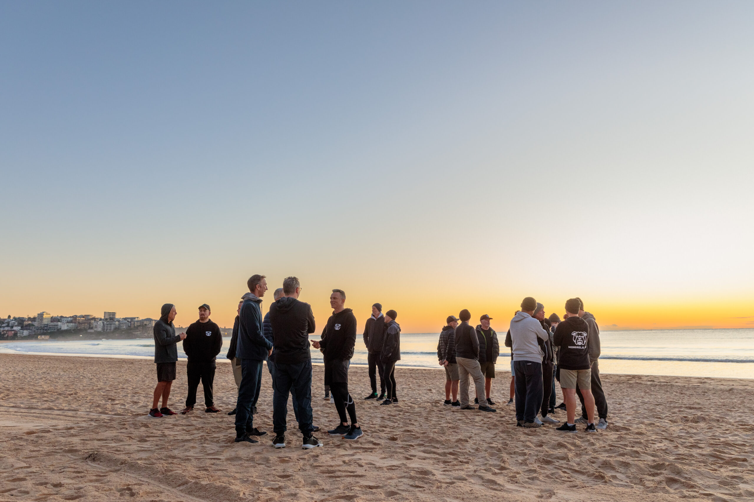 Mongrels Men Gathered on a Sydney Beach at dawn