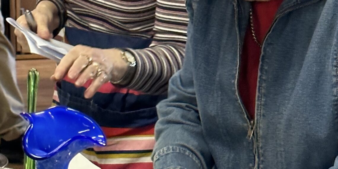 Photo of Lindfield volunteers sorting through donations