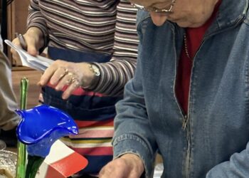 Photo of Lindfield volunteers sorting through donations