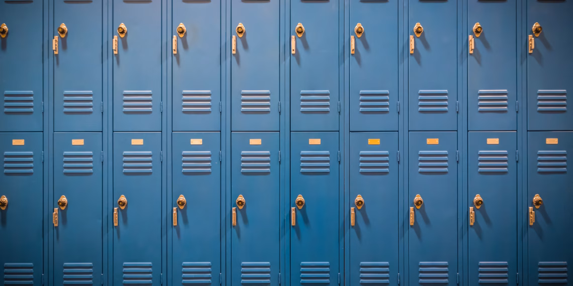 A row of blue lockers in a school.