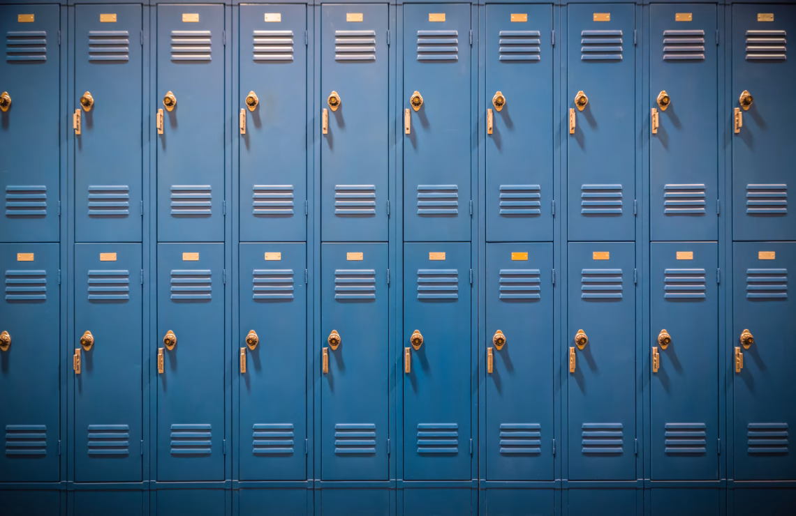 A row of blue lockers in a school.