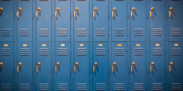 A row of blue lockers in a school.