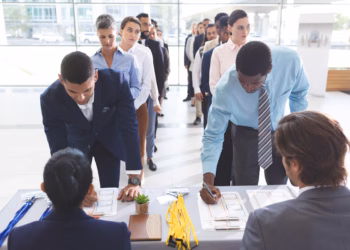 A group of people standing in line to vote