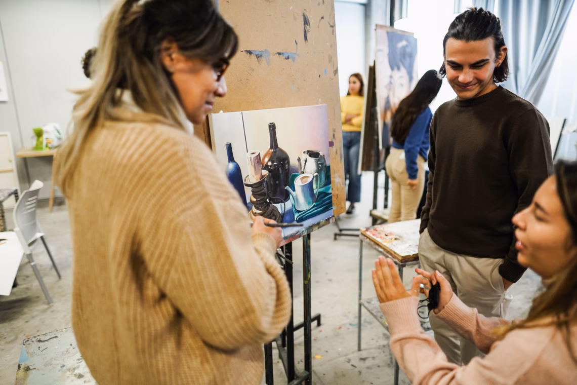 A group of people in an art studio.